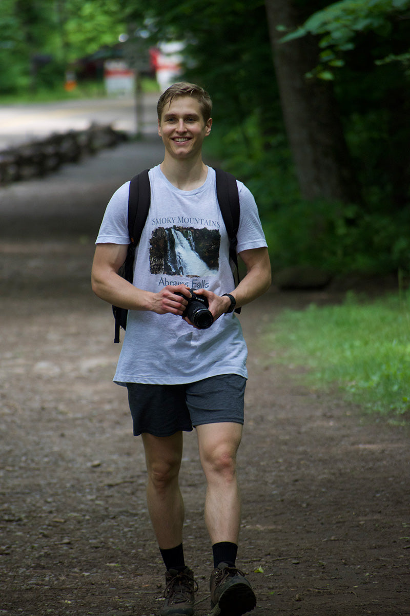 East Ridge Apparel founder Matthew holding his camera and wearing the Abrams Falls East Ridge Apparel T-Shirt on the Gatlinburg Trail Hike in the Great Smoky Mountains National Park.